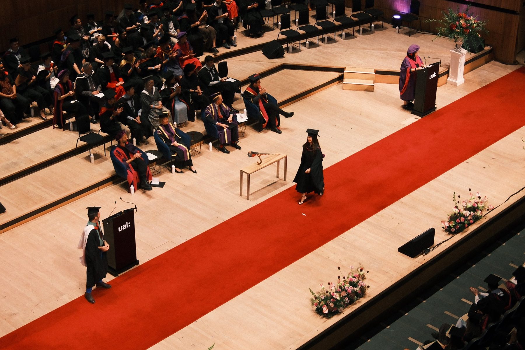 Gia crossing the stage at the UAL graduation ceremony